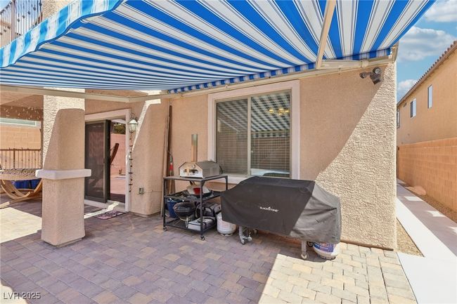 View of patio featuring area for grilling | Image 57