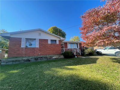 View of property exterior featuring a yard | Image 1