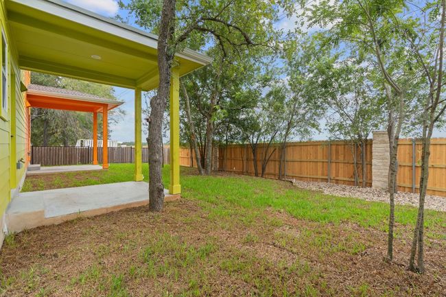 View of yard featuring a fenced backyard and a patio | Image 23