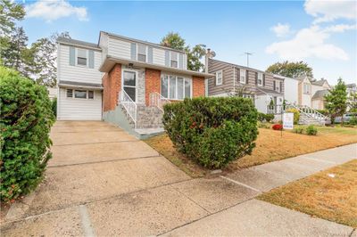 View of front of home featuring a garage | Image 2