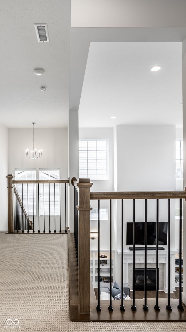 Staircase leading upstairs has a large landing area | Image 24