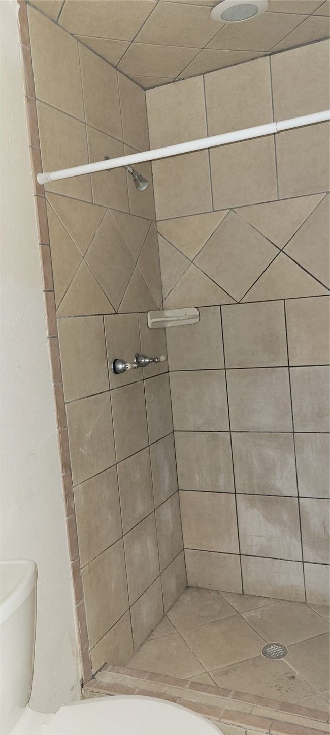 Bathroom with a tile shower | Image 25