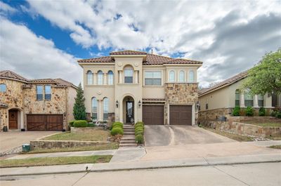 Mediterranean / spanish-style house featuring a garage | Image 2