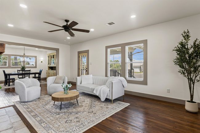 Living room featuring healthy amount of natural light, recessed lighting, wood-type flooring, and baseboards | Image 9