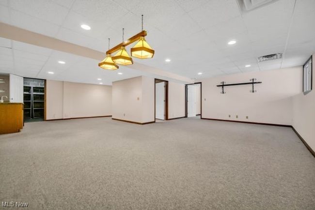 Finished rec room has 2 areas, wet bar with small refrigerator | Image 38