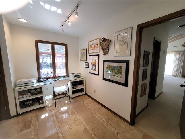 Office area with baseboards, ceiling fan, and track lighting | Image 52