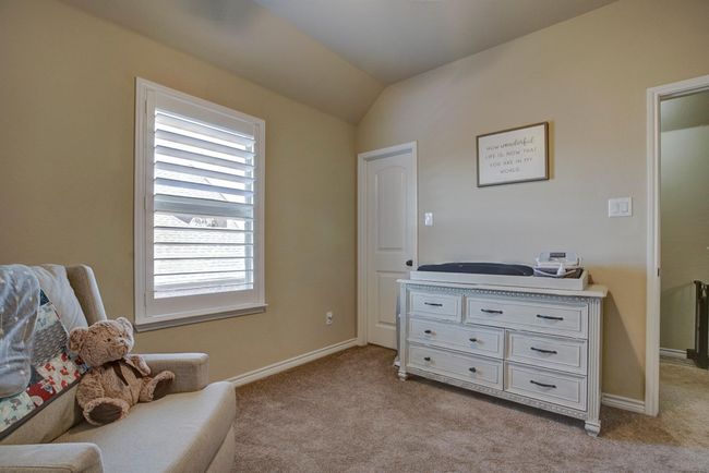 Living area with light carpet and lofted ceiling | Image 26