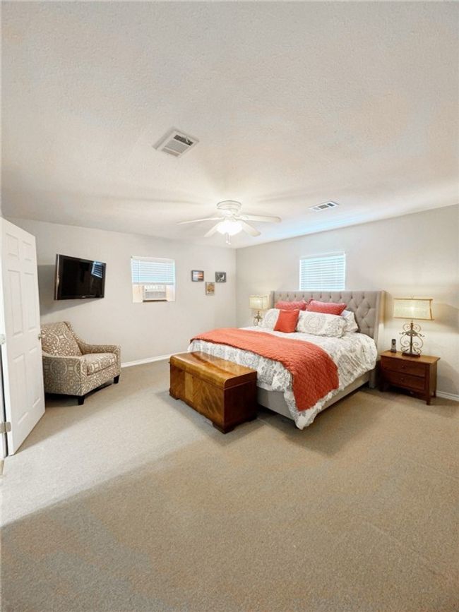 Bedroom with visible vents, baseboards, and carpet flooring | Image 14