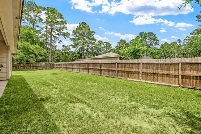 This large fenced backyard is perfect for children and pets to play and run around in. | Image 33