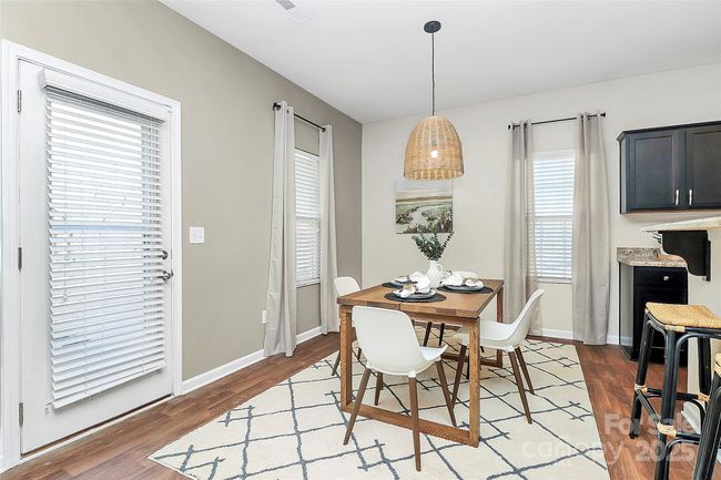 Dining area leading to patio door for easy indoor/outdoor flow. | Image 12