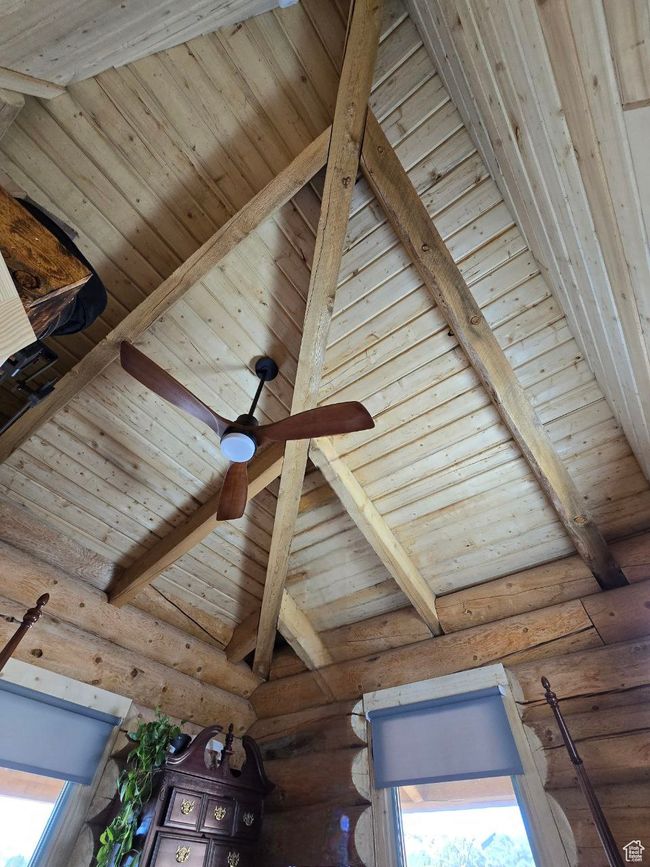 Room details with beam ceiling, rustic walls, and wood ceiling | Image 74