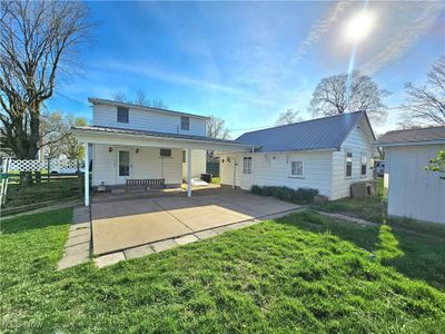 Back of property featuring a lawn | Image 1