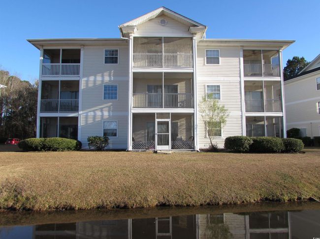 View of the rear of the building with a water view. | Image 8