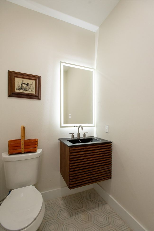 Bathroom featuring sink and toilet | Image 31