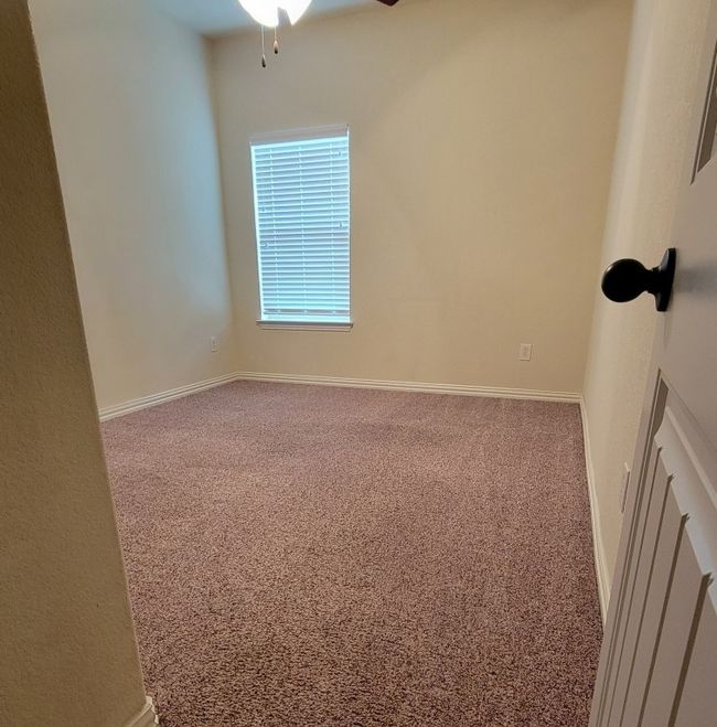 Carpeted empty room featuring ceiling fan and baseboards | Image 17