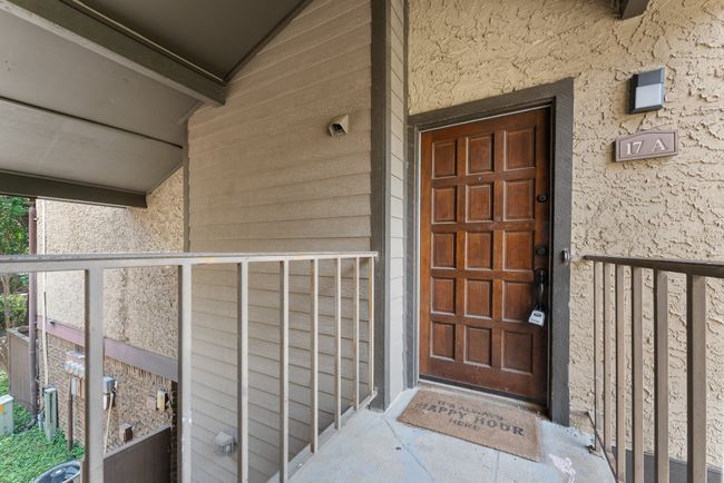 Doorway to property featuring stucco siding | Image 24