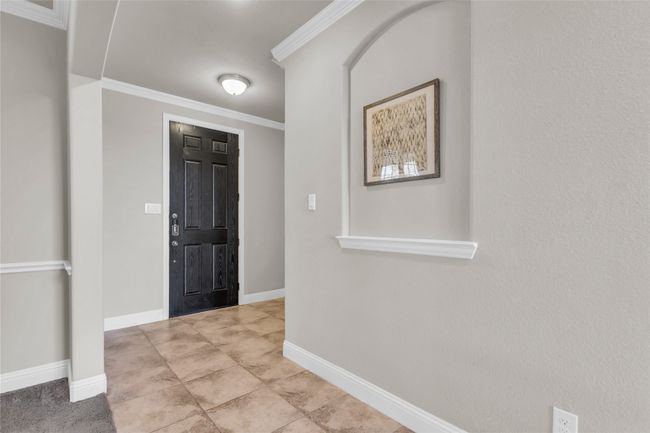 Foyer entrance featuring crown molding and baseboards | Image 13