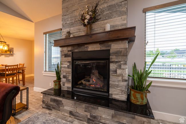 Detailed view of a stone fireplace and baseboards | Image 23