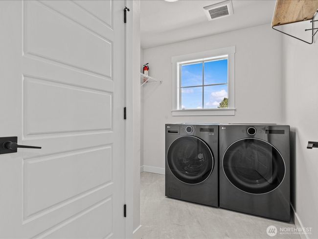 laundry room with washer and dryer | Image 26