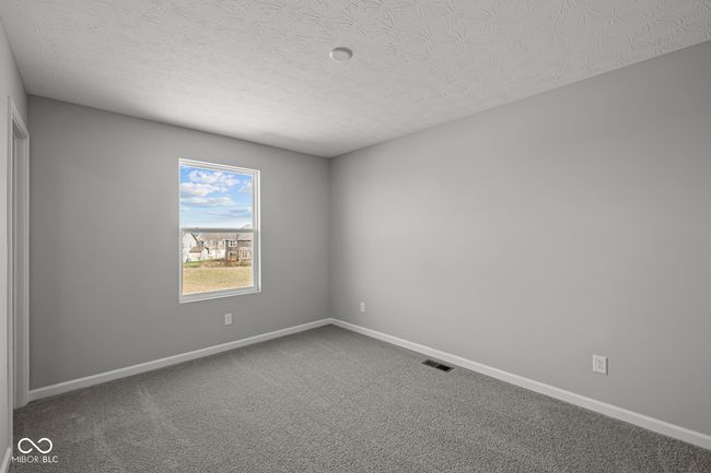carpeted spare room with baseboards, a textured ceiling, and visible vents | Image 20