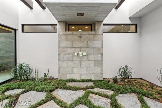 View of exterior entry with stucco siding | Image 36