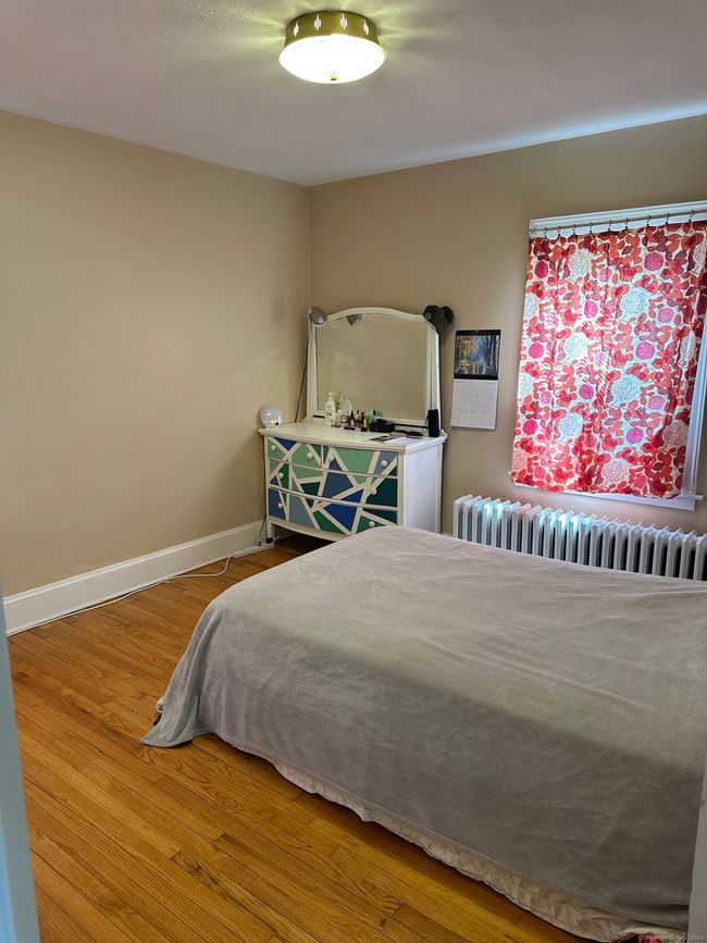 One of three generous size bedrooms with hardwood floors | Image 11