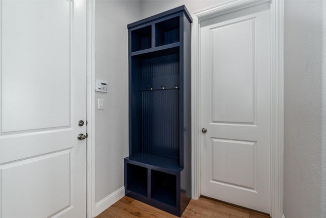 Mudroom with light wood-type flooring and baseboards | Image 27