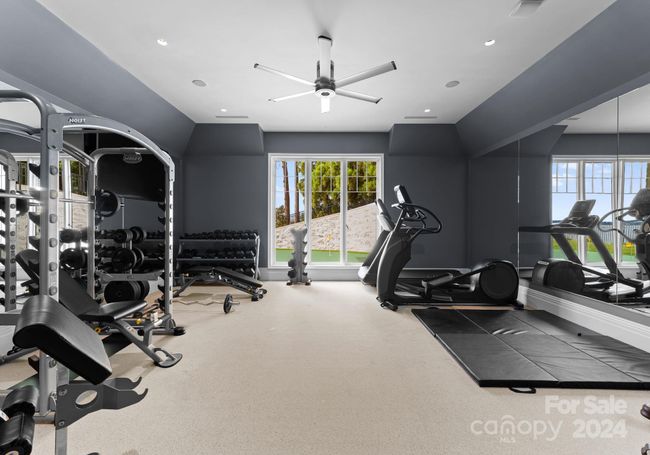 This gym is equipped with a full bathroom, surround sound, and ample space. | Image 33