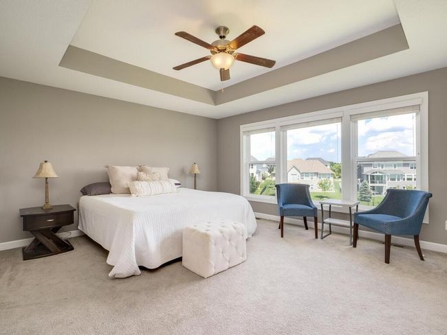 Upper level has a lovely owner's suite with free standing tub, his and her closets with walk-thru laundry. | Image 15