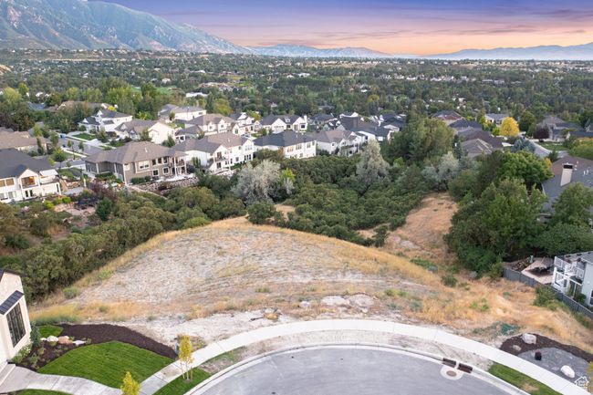 Aerial overview of property's location featuring a mountain backdrop and nearby suburban area | Image 17