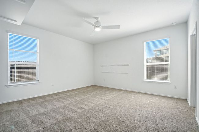 Unfurnished bedroom featuring carpet and ceiling fan | Image 23