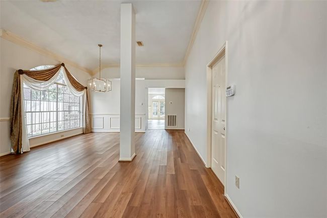 Open floor plan dining open to living room. | Image 4