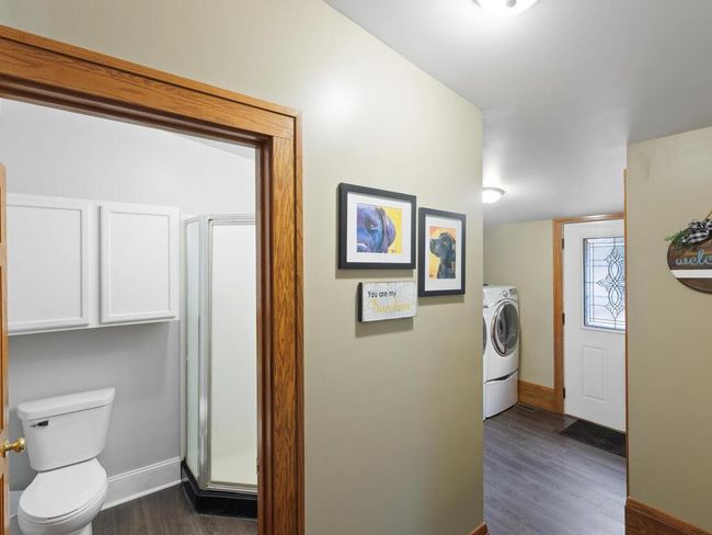 Entrance showing washer/dryer area and a 3/4 bath as you walk in | Image 18