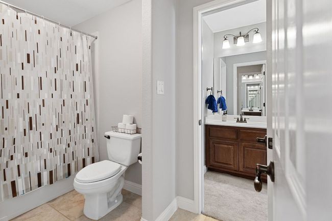 Guest Bath #2 is a double vanity shared bathroom accessible between two bedrooms. | Image 31