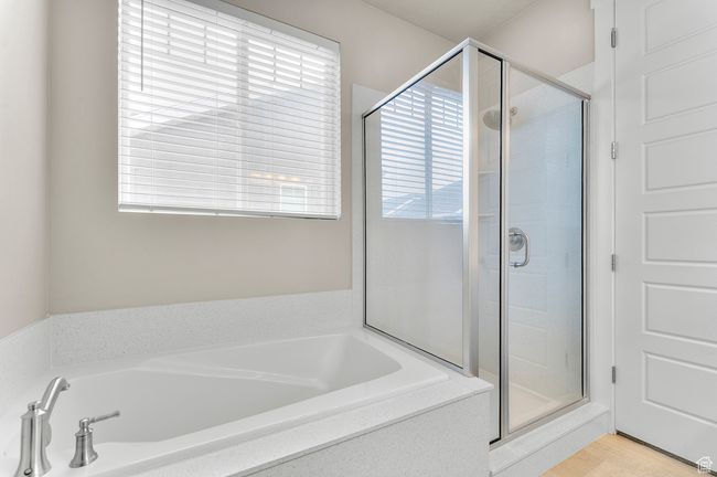 Full bath with a bath, a shower stall, and a healthy amount of sunlight | Image 11