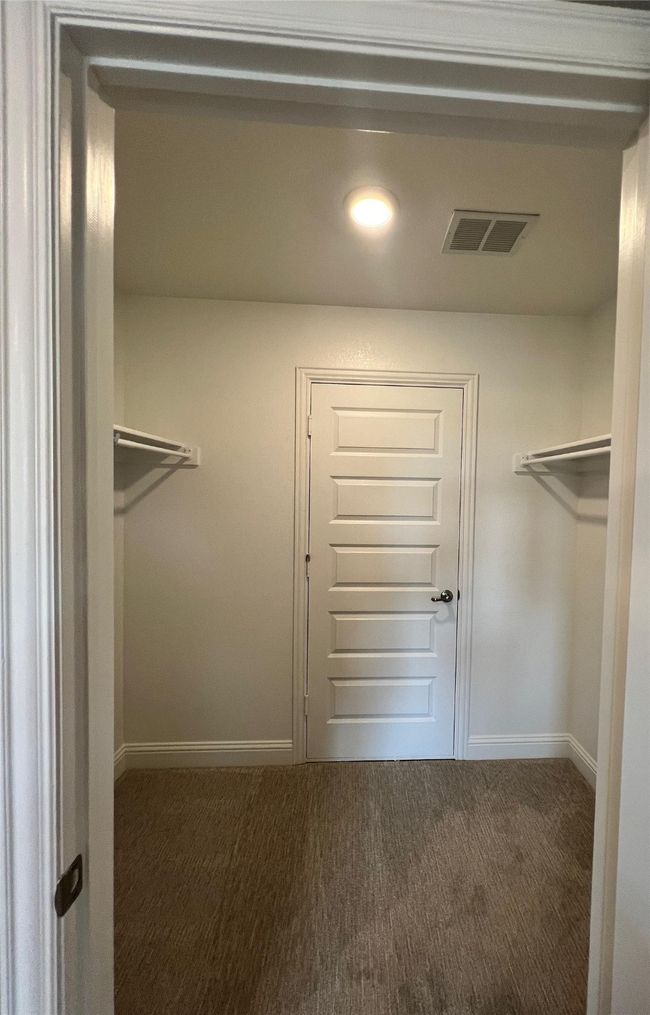 Spacious closet with carpet flooring | Image 25
