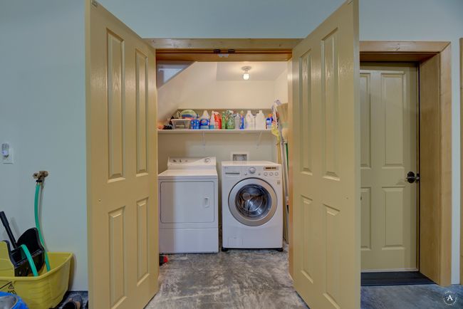 Laundry area with separate washer and dryer | Image 54