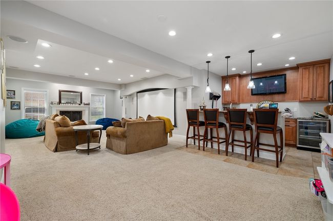Wet bar area with wine fridge, microwave and dishwasher | Image 28