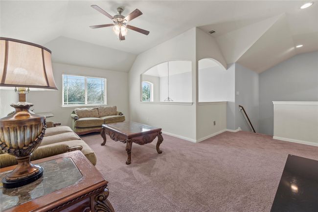 Overlooking the grand foyer, the game room is the perfect place to read, play, and study. Light pleasingly inundated the space creating a positive mood conducive to enjoyable activities! | Image 27