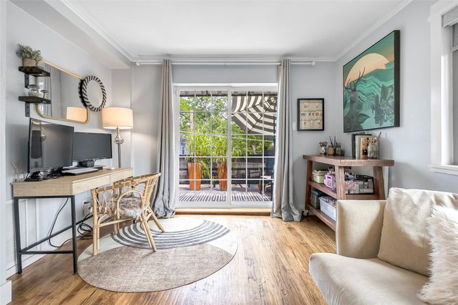 Home office with ornamental molding and wood finished floors | Image 29
