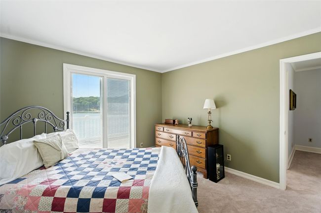Carpeted bedroom with access to exterior and ornamental molding | Image 30