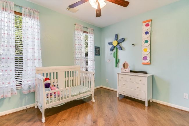 Downstairs Bedroom with Wood Floors could be an Office or Guest Suite | Image 14