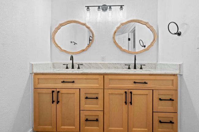Full bathroom with a sink and double vanity | Image 26