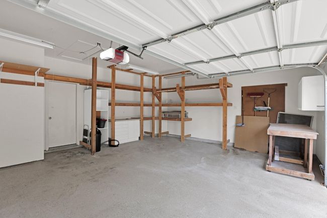 Garage featuring a garage door opener | Image 38