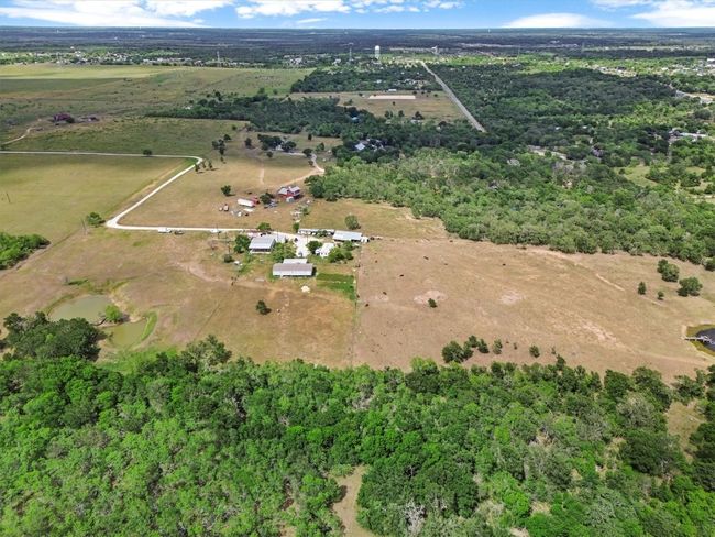 Tucked away on nearly 37 acres of peaceful Texas countryside, this one-of-a-kind property offers incredible versatility with over $250, 000 in improvements and four unique structures—making it the perfect canvas for a family compound, creative retreat, or income-producing estate. | Image 28