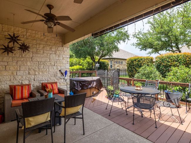 Deck featuring outdoor dining space, a hot tub, and ceiling fan | Image 22