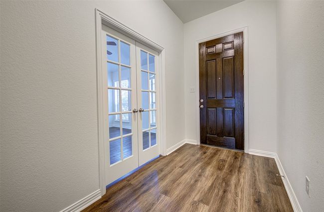 Entrance foyer with french doors and dark wood finished floors | Image 8