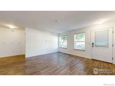 Living area with large windows and custom blinds throughout | Image 3