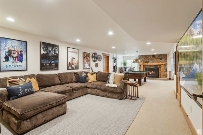 Living room featuring light carpet, recessed lighting, a fireplace, and billiards table | Image 51