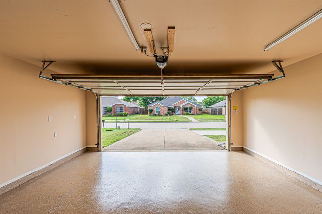 Garage with a garage door opener and a residential view | Image 28